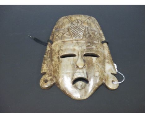 A Mayan style stone mask, 24cm high