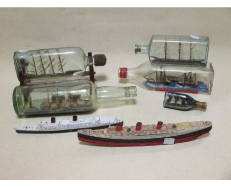 A Chad Valley cruise liner, various ships in bottles and die cast Queen Elizabeth