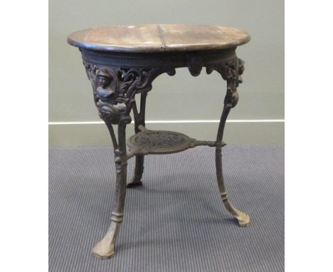 A 1920's cast iron pub table of circular form, eachleg moulded with the figurehead of Baden Powell above the intitals B.P., t