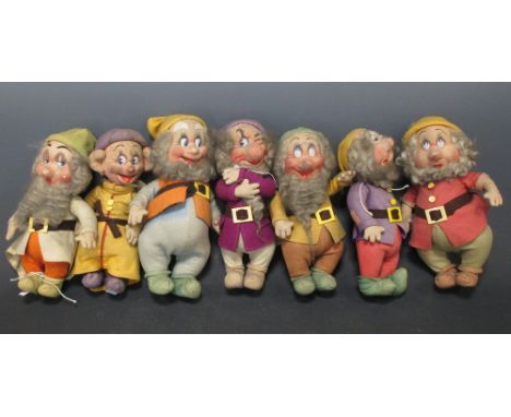 Chad Valley, a set of the seven dwarves, all with felt clothing and ivorine belt buckles, 27cm high (3)  