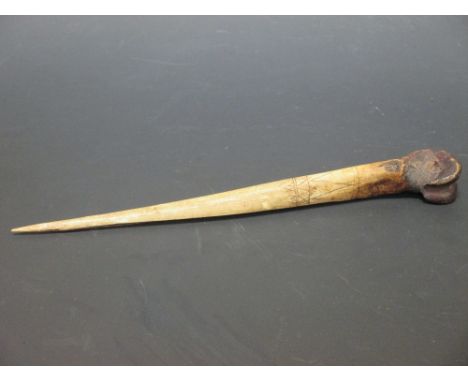 Papua New Guinea, Abelam people, Sepik region, a carved and shaped cassowary bone dagger, 30cm long
