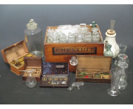 A 19th century oak cased scales, together with various glass chemists bottles and other items