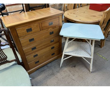 A modern pine chest with a rectangular top above two short and four long drawers on bracket feet together with a basket weave