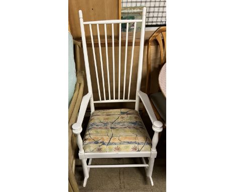 A white painted stick back rocking chair 