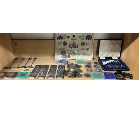 A set of four white metal Chinese panels together with Chinese spoons made from coins, Marie Theresia Thaler white metal moun