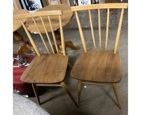 A pair of Ercol stick back kitchen chairs 