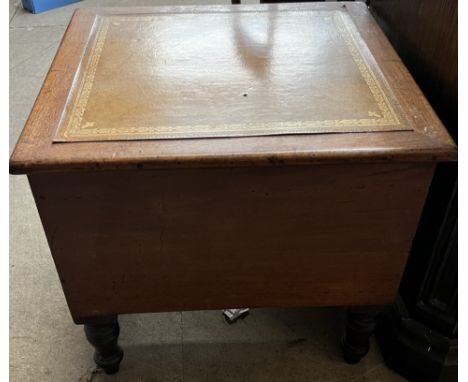 A Victorian mahogany commode converted to a sewing box, with a square leather inset top on turned legs 