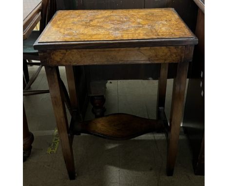 A late Victorian burr walnut side table with a rectangular top above a frieze drawer on square tapering legs united by a shel