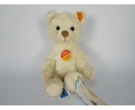 Steiff - An unboxed Steiff white plush bear #022739, standing approximately 26cms in height. The bear appears to be in Mint c