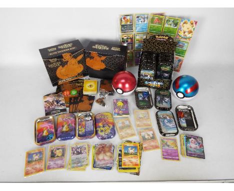 Pokemon - A quantity of Pokemon cards and collector tins. Lot includes a shop display box containing 10 x tins which contain 