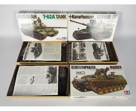 Tamiya - Three boxed Tamiya 1:35 scale plastic model tank kits. Lot contains Tamiya MM164 Kampfpanzer Leopard; MM208 Russian 