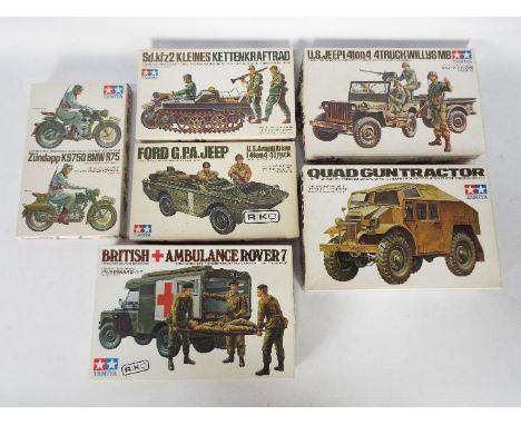 Tamiya - Six boxed 1:35 scale plastic military vehicle model kits by Tamiya. Lot includes Tamiya MM145 Quad Gun Tractor; MM11