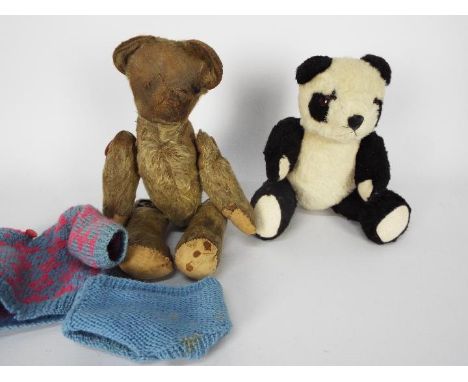 Two vintage soft toys. lot includes, a vintage jointed teddy bear. The unmarked jointed light brown mohair bear stands approx