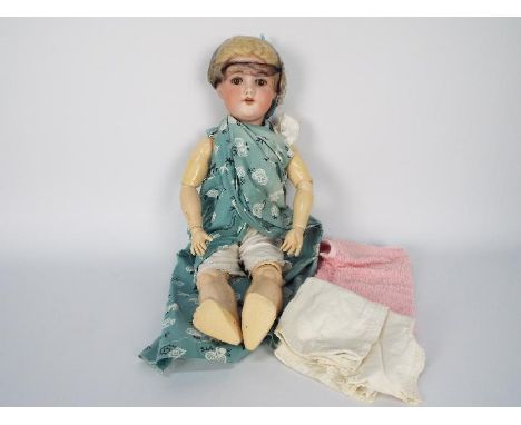 Armand Marsailles - A circa 1920s 22" tall bisque headed jointed compound body doll which is marked Armand Marsailles 390 - 6