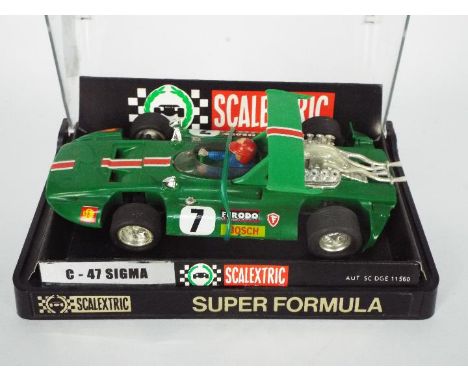 Scalextric Exinmex - A boxed Scalextric Exinmex (Mexico) C-47 Sigma. The model in green with RN7 is marked 'Made in Mexico' t
