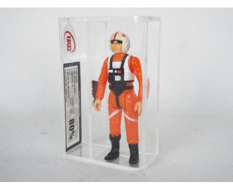 Star Wars - A loose vintage and graded Star Wars 3 3/4 action figure Luke Skywalker X-Wing Pilot'. The figure is UK Graded at