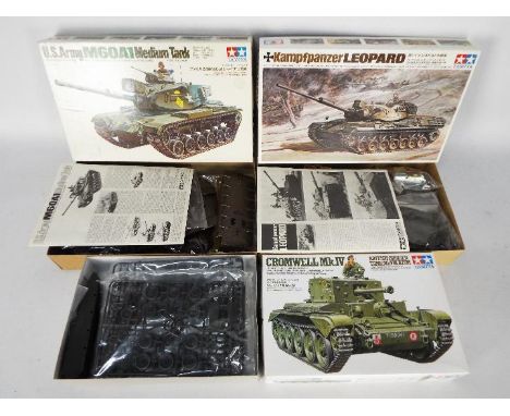 Tamiya - Three boxed Tamiya 1:35 scale plastic model tank kits. Lot contains Tamiya #35221 Cromwell Mk.IV; MT128 US Army M60 
