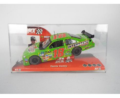 SCX - Slot Car model in 1:32 Scale - # 64390 Toyota Camry Interstate Batteries. Featuring Nascar #18 and Driver Kyle Busch. A