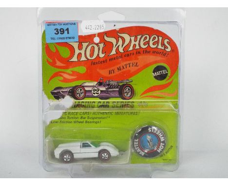 Hot Wheels - Redline - An original unopened carded Ford J-Car model in Enamel White. This Hong Kong made model appears Near M