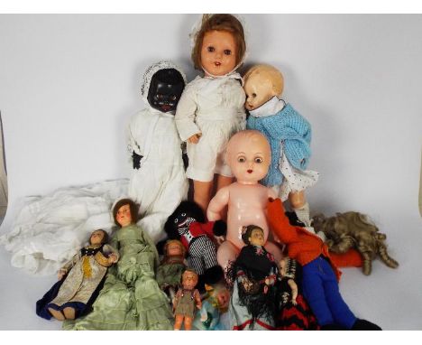 Pedigree., Other - A collection of vintage plastic and composition dolls. Lot includes a Pedigree black doll with speech box,