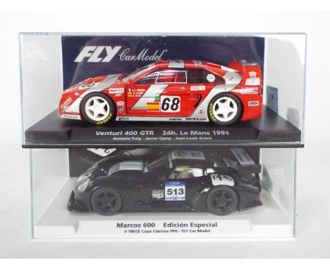 Fly - Two boxed 1:32 scale slot cars from Fly. Lot consists of #99070 Limited Edition Marcos LM600 Copa Del Clasicos V.Trece'