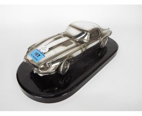 Silver Dreams - Jaguar E-Type series 3 roadster metal effect model in 1:18 scale. The car appears in Very Good condition with