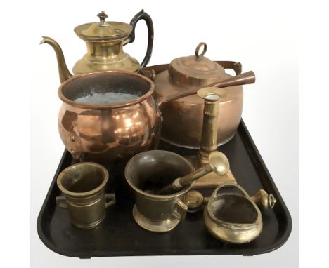 Brass and copper wares including tea pots, cooking pot, candlestick, pestle and mortars, etc.