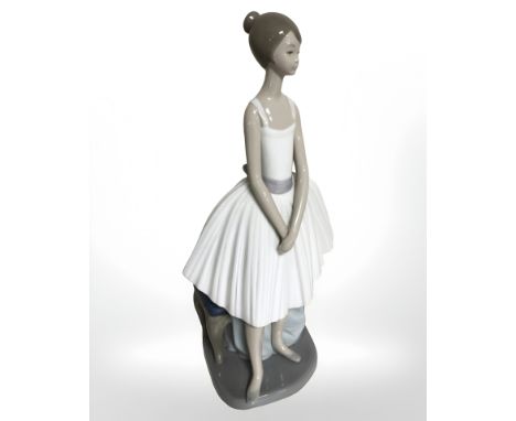 A Nao figure of a standing ballerina. 