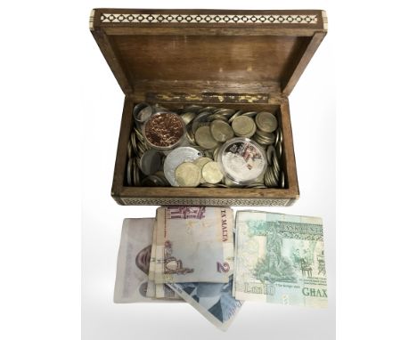 An Anglo Indian bone and mother of pearl inlaid trinket box containing mixed coins and a small quantity of bank notes, novelt