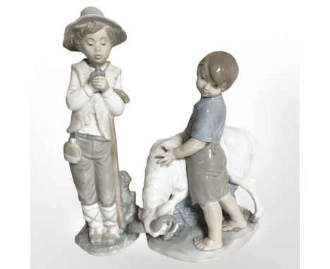 Two Nao figures of shepherd boys.