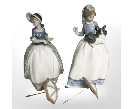 Two Nao figures of ladies with parasols.