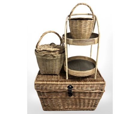 A wicker hamper, two tier table and three baskets. 