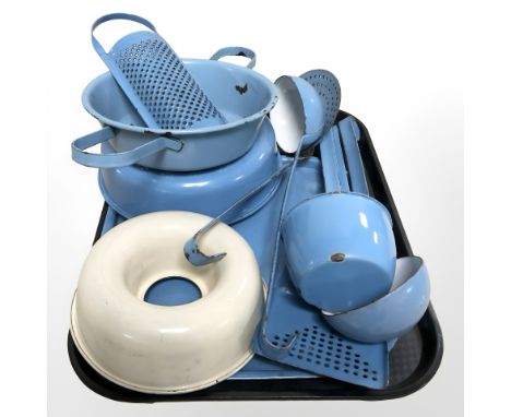 A group of 20th century enamel kitchen wares including ladles, collander, bread mould etc 