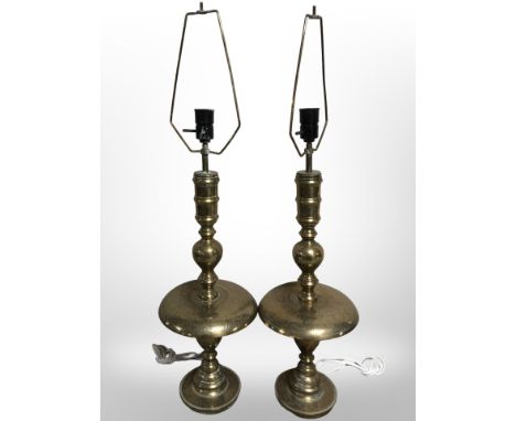 A pair of Indian engraved brass candlesticks converted into lamp bases, height 84 cm including fitting. CONDITION REPORT: Req