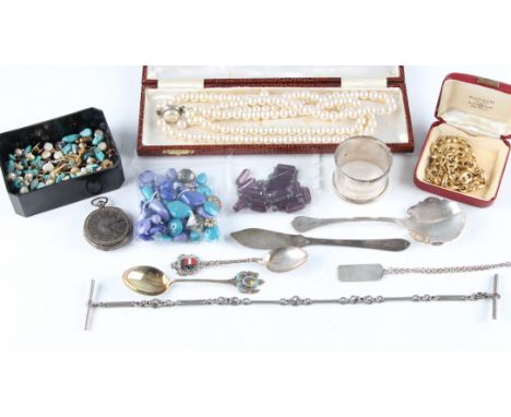 A collection of hallmarked silverware, to include a napkin ring, a pastry knife, a spoon, a pendant, together with a white me