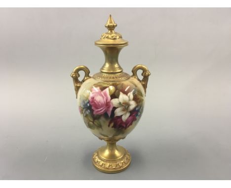 A Royal Worcester lidded urn, signed F J Bray. Height 26cm.