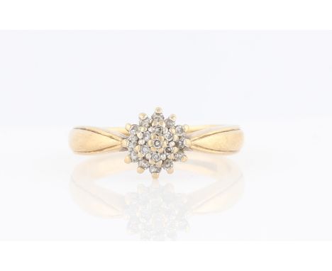 A hallmarked 9ct yellow gold diamond cluster ring, set with eight cut diamonds in three tiers, ring size M.