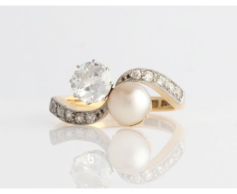 A diamond and pearl ring, set principally with an Old European cut diamond, measuring approx. 0.85ct, and a pearl, in cross o