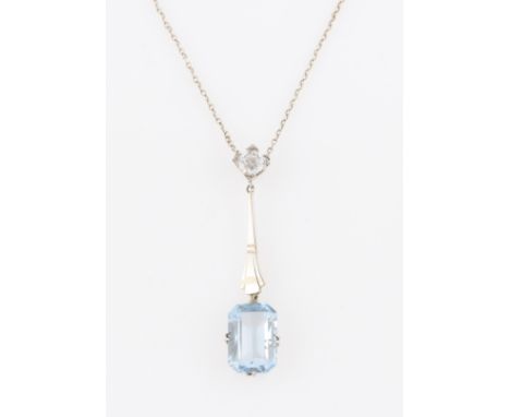 A synthetic blue spinel and white sapphire necklet, the emerald cut blue spinel suspended from tapered stepped metalwork surm