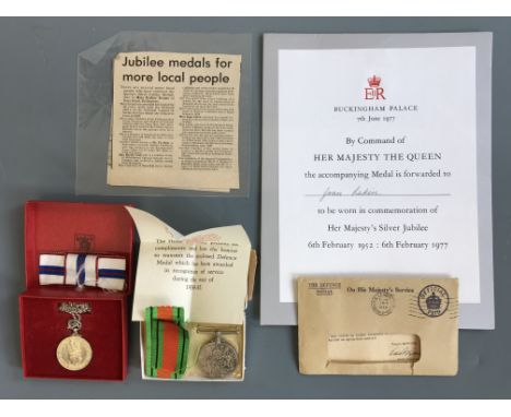 Two medals awarded to Joan Larkin including Silver Jubilee Medal, with certificate and newspaper cutting detailing her twenty