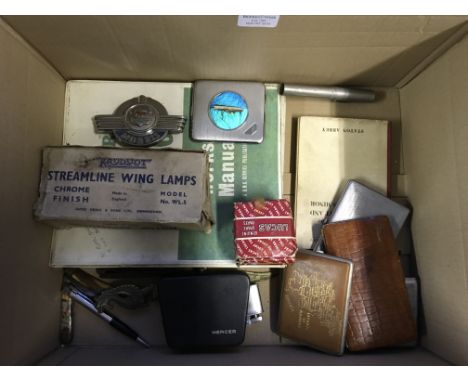 A Morris miner works shop manual, a car badge, streamline wing lamps, various cigarette lighters, cigarette boxes etc.