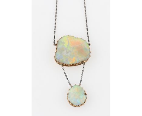 An opal necklet, set with an irregular shaped piece of opal, measures approx. 23x22mm, suspending a pear shaped piece of opal