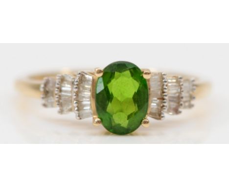 A 9ct gold oval cut diopside and baguette cut diamond ring, claw set, M, 2g 