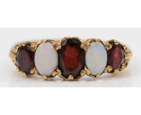 A 9ct gold opal and garnet five stone cluster ring, Q 1/2, 3.9g 