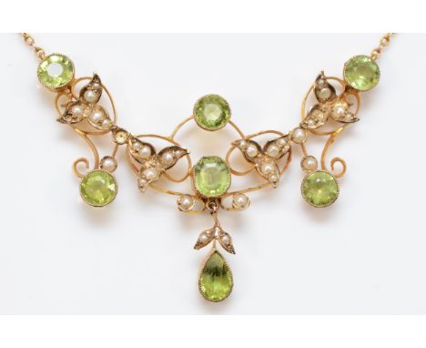 An Edwardian 9ct gold peridot and half pearl necklace, milligrain collet set stones, 50 x 38mm, back chain, 9ct tab, 6.5gm, t