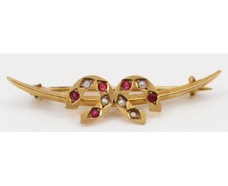 A Victorian Australian 9ct gold red paste and half pearl double horseshoe brooch, one stone missing, 40mm 