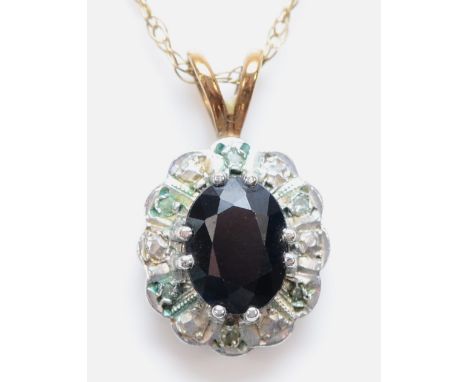A 9ct gold oval cut sapphire and diamond cluster pendant necklace, 13mm pendant, 2.3g 