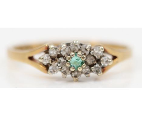 A 9ct gold emerald and diamond cluster ring, K 1/2, 1.4gm 