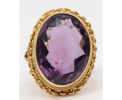 A vintage 9ct gold and large amethyst dress ring, 19 x 14mm, rope twist border, K 1/2, 7.3gm 