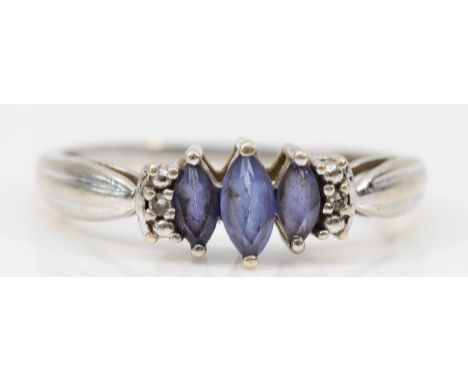 A 9ct gold marquise cut tanzanite and diamond ring, claw set, R 1/2, 2.2g 